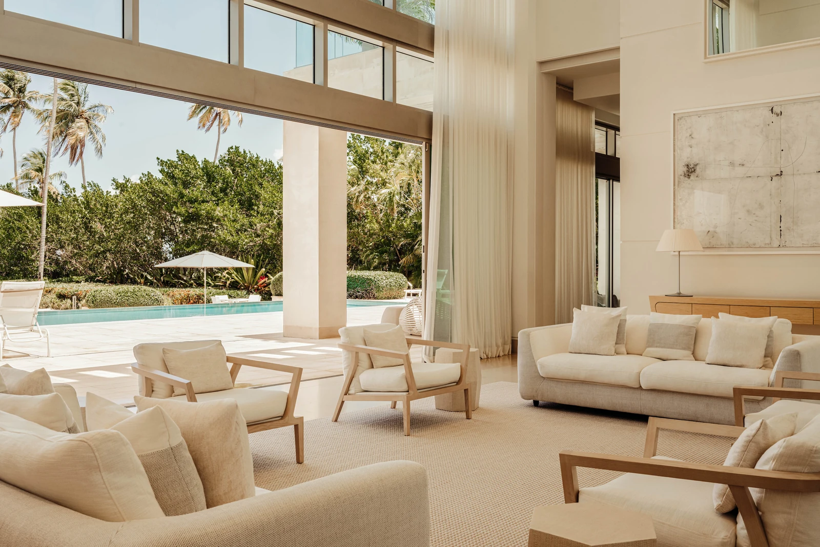 Casa Estancias living room opening to its pool terrace, Bahía Beach, Puerto Rico